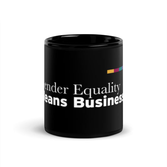 Black mug with the words "Gender Equality Means Business" printed in white. On the bottom to the right of those words is The SHE Mark logo in white with the words "The SHE Mark" below it. Above the main graphic is a line of five rectangles in the following color order: gold, ruby, teal, purple, and green.