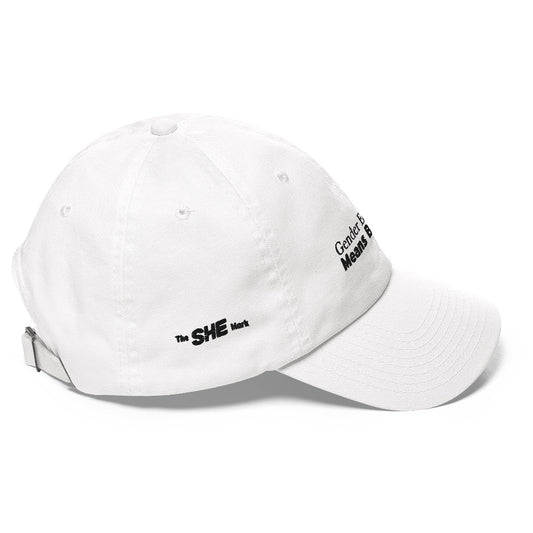 White dad hat with the phrase "gender equality means business" embroidered on the front, in the center. The phrase is in black text, with the words "means business" in bold font. Above the phrase and to the right is a bar with rectangles of the following colors: gold, ruby, teal, purple, and green. On the right side of the hat is embroidered "The SHE Mark" in black.