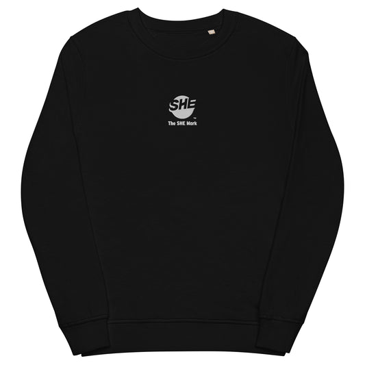 Black crewneck sweatshirt with the SHE Mark logo printed on the front in white with the words "The SHE Mark" below it also in white.