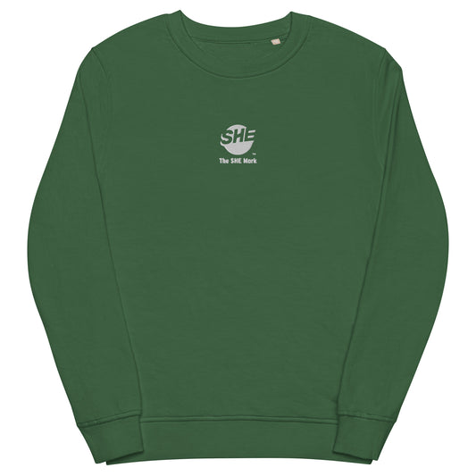 Green crewneck sweatshirt with the SHE Mark logo printed on the front in white with the words "The SHE Mark" below it also in white.